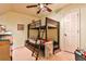Shared bedroom featuring a bunk bed, door to the hall, and playful decorations at 1137 Maple Creek Rdg, Loganville, GA 30052