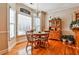 Cozy breakfast nook with large windows and a wooden dining set at 1137 Maple Creek Rdg, Loganville, GA 30052