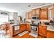 Bright kitchen with stainless steel appliances and hardwood floors at 1137 Maple Creek Rdg, Loganville, GA 30052