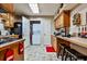 Functional kitchen with a breakfast bar, appliances, and convenient laundry access at 1137 Maple Creek Rdg, Loganville, GA 30052