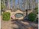 Stone community sign for Maple Creek, surrounded by lush greenery at 1137 Maple Creek Rdg, Loganville, GA 30052