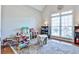 Bright playroom with hardwood floors, large windows, and a variety of toys at 1137 Maple Creek Rdg, Loganville, GA 30052