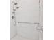 Tiled shower featuring multiple shower heads, grab bar and built in niche for soaps and shampoos at 1137 Maple Creek Rdg, Loganville, GA 30052