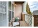 Inviting outdoor balcony with seating, a decorative pendant light, and a calming color scheme at 1965 Nocturne Dr # 1305, Alpharetta, GA 30009