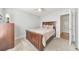 Cozy bedroom with carpeted floors, gray walls, closet, ceiling fan, and a bed with a wooden frame and light colored bedspread at 80 Pooles Bend Ct, Hiram, GA 30141