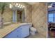 Bathroom featuring a white vanity, tan countertops, and tile-look wallpaper at 500 Nicole Se Ct, Conyers, GA 30094