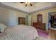 Bedroom featuring a tray ceiling, wood-look flooring, and wood furniture set at 500 Nicole Se Ct, Conyers, GA 30094