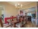 Inviting dining room features a chandelier, wooden table, and seamless flow into the adjacent living space at 500 Nicole Ct Se, Conyers, GA 30094