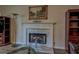 Close-up of a marble fireplace with decorative mantel in a well-lit living room at 500 Nicole Se Ct, Conyers, GA 30094