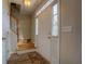 Inviting foyer featuring a white front door, hardwood floors, and staircase at 500 Nicole Se Ct, Conyers, GA 30094
