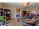 Cozy living room with a fireplace, hardwood floors, and comfortable seating area at 500 Nicole Se Ct, Conyers, GA 30094