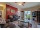 Spacious living room with hardwood floors, large windows, and a comfortable seating arrangement at 500 Nicole Se Ct, Conyers, GA 30094