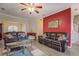 Open-concept living room with hardwood floors, stylish decor, and comfortable leather sofas at 500 Nicole Se Ct, Conyers, GA 30094
