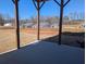 View of new construction homes from back porch with bare lawn at 2235 Windsor Bluffs Dr, Cumming, GA 30041