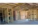 Unfinished basement with exposed wood framing and pink insulation at 2235 Windsor Bluffs Dr, Cumming, GA 30041