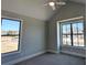 Bright bedroom with large windows offering natural light and views of the neighborhood at 2235 Windsor Bluffs Dr, Cumming, GA 30041