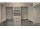 Spacious walk-in closet with built-in shelving and ample storage space at 2235 Windsor Bluffs Dr, Cumming, GA 30041