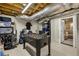 Spacious basement featuring foosball table, storage, and access to additional living space at 2436 Elmwood Se Cir, Atlanta, GA 30339