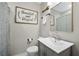Cozy bathroom with a modern vanity, framed mirror, and decorative 
