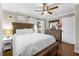 Bedroom featuring hardwood floors, neutral walls, and a comfortable bed with white linens at 2436 Elmwood Se Cir, Atlanta, GA 30339