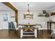 Inviting dining room with wooden table, bench seating, elegant chandelier, and stylish decor at 2436 Elmwood Se Cir, Atlanta, GA 30339