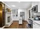 Bright eat-in kitchen features white cabinets, granite countertops, and stainless steel appliances at 2436 Elmwood Se Cir, Atlanta, GA 30339