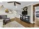 Inviting living room featuring a decorative brick wall and hardwood floors at 2436 Elmwood Se Cir, Atlanta, GA 30339