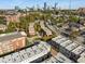 Aerial view of townhomes with a cityscape backdrop, nestled among trees and buildings at 304 Stonemont Dr, Atlanta, GA 30305