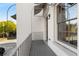 Balcony with gray wood-look flooring, white brick walls, and railings at 304 Stonemont Dr, Atlanta, GA 30305