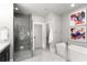 Sleek bathroom with a glass shower, freestanding tub, and modern fixtures at 304 Stonemont Dr, Atlanta, GA 30305