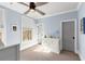 Comfortable bedroom with blue walls, a ceiling fan, and a dresser at 304 Stonemont Dr, Atlanta, GA 30305