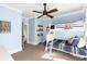 Blue bedroom with bunk beds, ceiling fan, and ample natural light at 304 Stonemont Dr, Atlanta, GA 30305