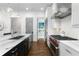 Well-appointed kitchen with marble countertops, stainless appliances, gas range, and hardwood flooring at 304 Stonemont Dr, Atlanta, GA 30305