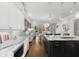Open-concept kitchen with marble countertops, island, stainless steel appliances, and pendant lighting at 304 Stonemont Dr, Atlanta, GA 30305