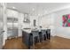 Bright kitchen boasts a marble island, stainless appliances, stylish pendant lights, and white cabinets at 304 Stonemont Dr, Atlanta, GA 30305