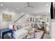 Comfortable living room with a cozy sectional, stylish decor, fireplace, and an open view to the kitchen at 304 Stonemont Dr, Atlanta, GA 30305