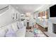 Bright living room with contemporary furnishings, an open floor plan, and dining area visible in the background at 304 Stonemont Dr, Atlanta, GA 30305