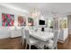 Bright living and dining area with modern decor, colorful art, hardwood floors, and large windows at 304 Stonemont Dr, Atlanta, GA 30305