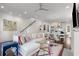 Bright living room with sectional sofa, chandelier, adjacent dining area, and hardwood floors at 304 Stonemont Dr, Atlanta, GA 30305