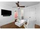 Bright office space with hardwood floors, TV, designer desk, and adjacent bathroom access at 304 Stonemont Dr, Atlanta, GA 30305