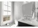 Chic powder room with unique wallpaper and a window for natural light at 304 Stonemont Dr, Atlanta, GA 30305