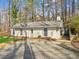 Charming home featuring a well-manicured lawn, classic windows, and a cozy front entrance at 3510 Riviera Dr, Cumming, GA 30041