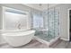 Modern bathroom featuring a freestanding tub and glass-enclosed shower at 600 Blackwater Rdg, Canton, GA 30114