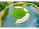 Unique view of an island green on the golf course surrounded by a water hazard and sand bunkers at 600 Blackwater Rdg, Canton, GA 30114