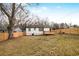 Cozy backyard featuring a new wooden fence, deck, and a white home with a red door at 1459 Kenilworth Sw Dr, Atlanta, GA 30310