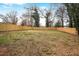Large backyard with wooden privacy fence and grass, offering ample space for outdoor activities and recreation at 1459 Kenilworth Sw Dr, Atlanta, GA 30310