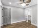 This bedroom features hardwood floors, gray walls, a large closet, and a gray painted door at 1459 Kenilworth Sw Dr, Atlanta, GA 30310