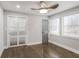 Bright bedroom features hardwood floors, ample natural light, and a contemporary ceiling fan at 1459 Kenilworth Sw Dr, Atlanta, GA 30310