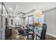 Modern living room with a dining area, hardwood floors, stylish lighting, and neutral decor at 1459 Kenilworth Sw Dr, Atlanta, GA 30310