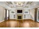 Spacious living room with fireplace, built-in cabinets, and coffered ceiling at 1590 N Morningside Ne Dr, Atlanta, GA 30306